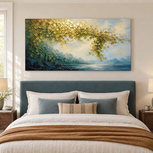 Golden foliage and misty blue water landscape painting without an outer frame in a bedroom.