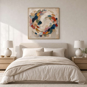 Soft multicolor abstract wall art styled above a serene neutral bedroom.