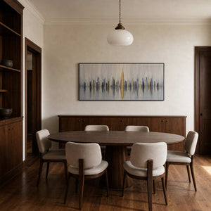 Textured cityscape wall art displayed in a refined dining room.