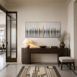 Textured cityscape wall art displayed in a refined entryway gallery.