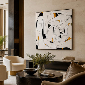 Black-framed geometric artwork overlooking a lounge coffee table.