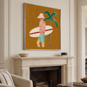 Angled view of the surfer and palm painting above a pale stone fireplace.