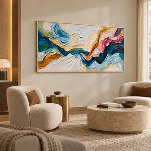 Flowing abstract painting above pale curved lounge seating with ochre cushions.