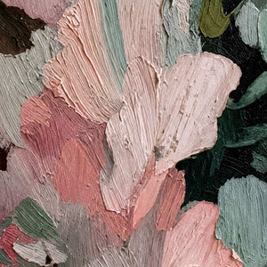 Close view of thick pink and green brushstrokes with raised ridges and layered edges.
