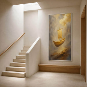 Elongated golden boat painting beside a warm white staircase.