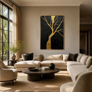 Black and gold textured tree wall art displayed in a warm modern living room.