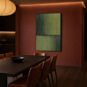 Minimalist green artwork in a brick-red modern dining room.