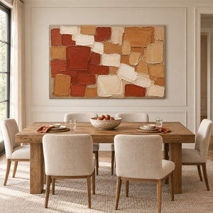Terracotta, ochre, and cream raised block painting without an outer frame in a dining room.
