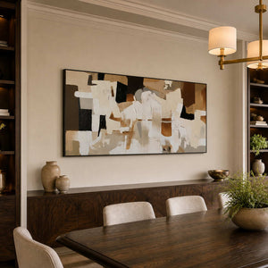 Black framed cream and brown abstract artwork above a dark wooden dining sideboard.