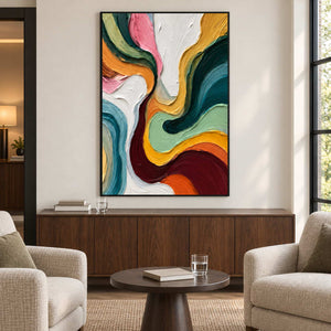 Colorful curved artwork above a cabinet between two cream armchairs.