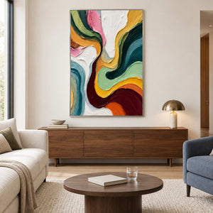 Colorful vertical abstract above a wooden cabinet between lounge seats.