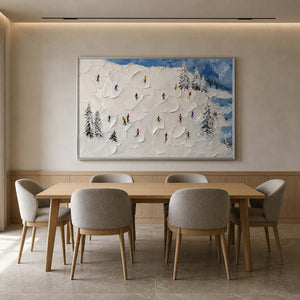 Snowy ski landscape displayed above a light wood dining table.