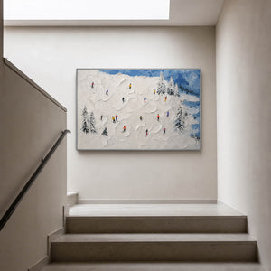Horizontal ski painting displayed at a light-filled stair landing.
