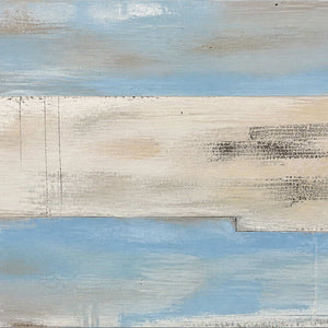 Close-up of pale blue, ivory, sand, and charcoal dry-brushed surface detail.