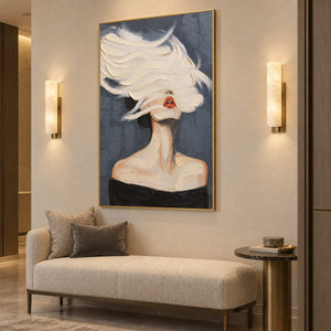 White-swept face artwork over a cream bench between two illuminated wall sconces.