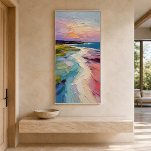 Tall colorful coastal artwork displayed above a stone entryway console.