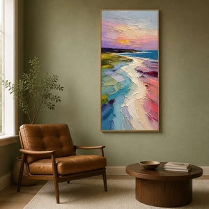 Textured sunset shoreline painting displayed in a sage green reading room.