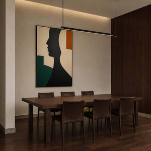 Graphic figurative canvas displayed in a dark walnut dining room.