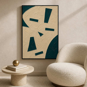 Ivory geometric wall art styled beside a quiet reading chair.