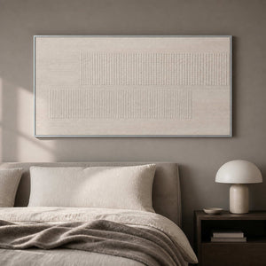 Quiet geometric relief canvas displayed above a neutral bed.