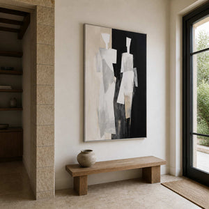 Silver framed painting of two figures above a wooden bench in a stone entryway.