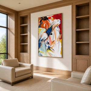 Wood-framed expressive abstract painting between walnut shelves and cream armchairs in a study lounge.