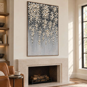 Tall gray floral painting above a fireplace near bookshelves.