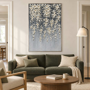 White floral artwork above an olive-green sofa.