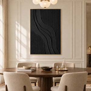 Tall black abstract behind an oval dining table on a cream paneled wall.