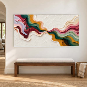 Wide ribbon composition above a cream upholstered wooden bench.