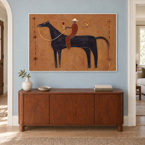 Rider-and-horse painting above a wooden cabinet on a blue wall.