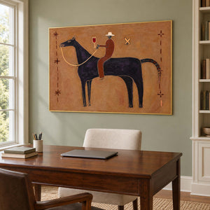 Black horse artwork over a wooden desk against a green wall.