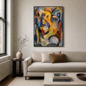 Black framed yellow and blue abstract painting above a sofa in a neutral living room.