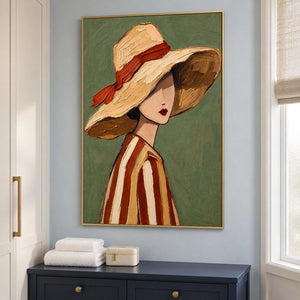 Turned figure portrait above a navy dresser with white towels near a window.
