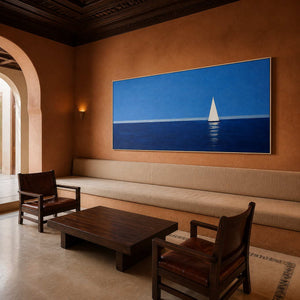 Blue sailboat wall art displayed in a warm architectural family room.