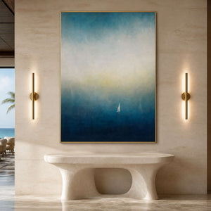Vertical blue sailboat artwork displayed in a refined hotel lobby.