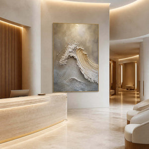 Sculptural wave painting in an ivory travertine wellness reception.