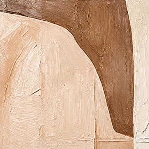 Close-up of raised brush marks and curved edges where cream, peach, and caramel paint meet.