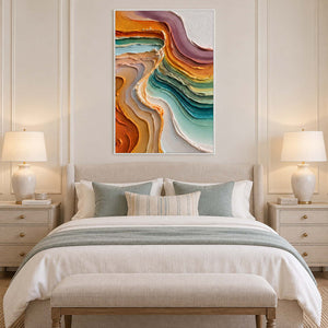 White-framed curved-band artwork above a pale bed with muted aqua pillows.
