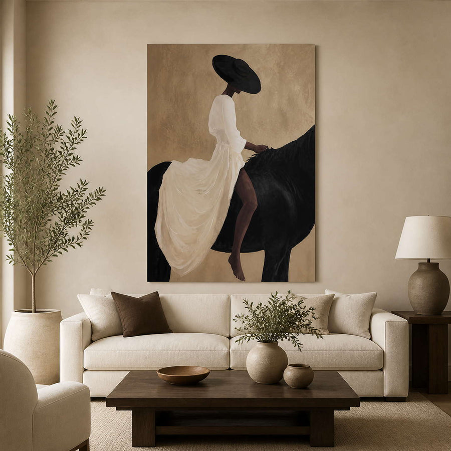 Equestrian wall art above a cream sofa with a frameless presentation.