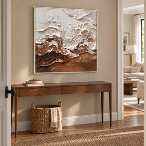At Ease in a white frame above a narrow wood hallway console with a woven basket beneath.