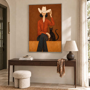 At Leisure in a silver frame above a wood hallway console with a table lamp and cream stool.