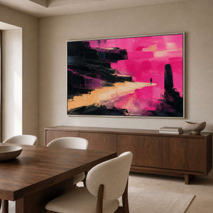 Pink textured wall art in a silver frame beside a dining table.
