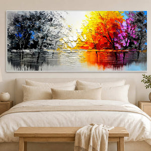 White-framed autumn lake landscape above an ivory bed with a natural wood bench.