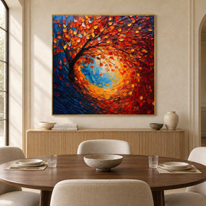 Orange-leaf tree painting over a slatted sideboard behind an oval dining table.