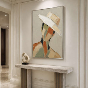 Vertical textured portrait wall art in a luxury entryway with a silver frame.