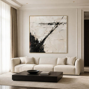 Textured black and ivory abstract wall art in a refined living room.