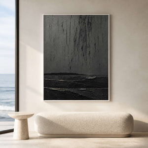 Charcoal textured wall art displayed in a light ocean-view lounge.