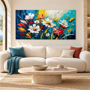 Hand-painted panoramic floral wall art in cobalt, turquoise, white, red, and yellow, displayed in a living room without an outer frame.