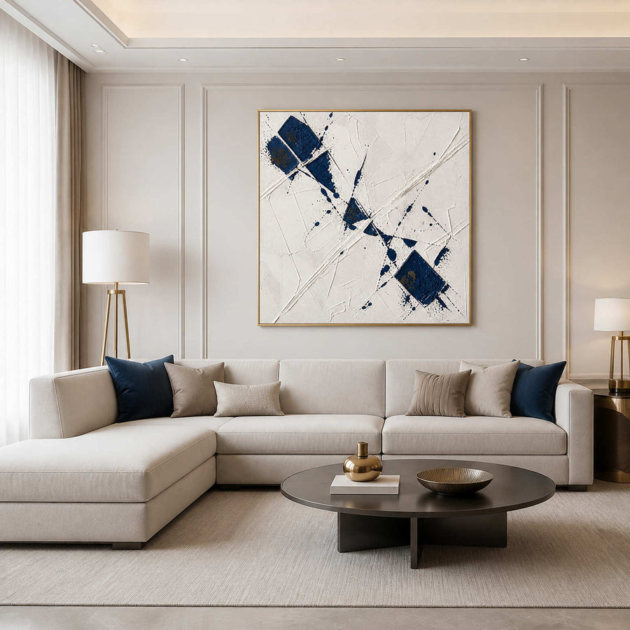 Blue and white textured abstract wall art in a serene modern living room.